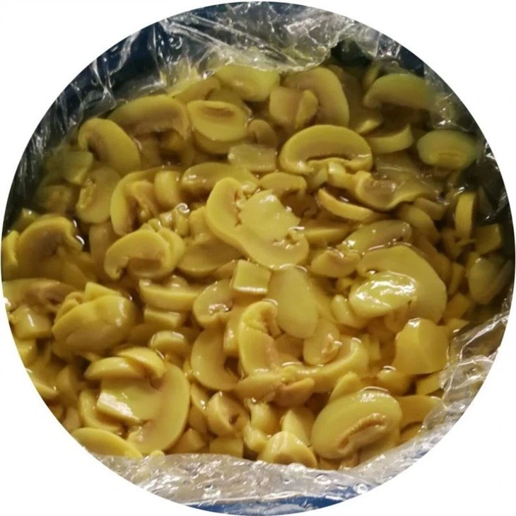 Food white mushroom sliced in salted water in drums